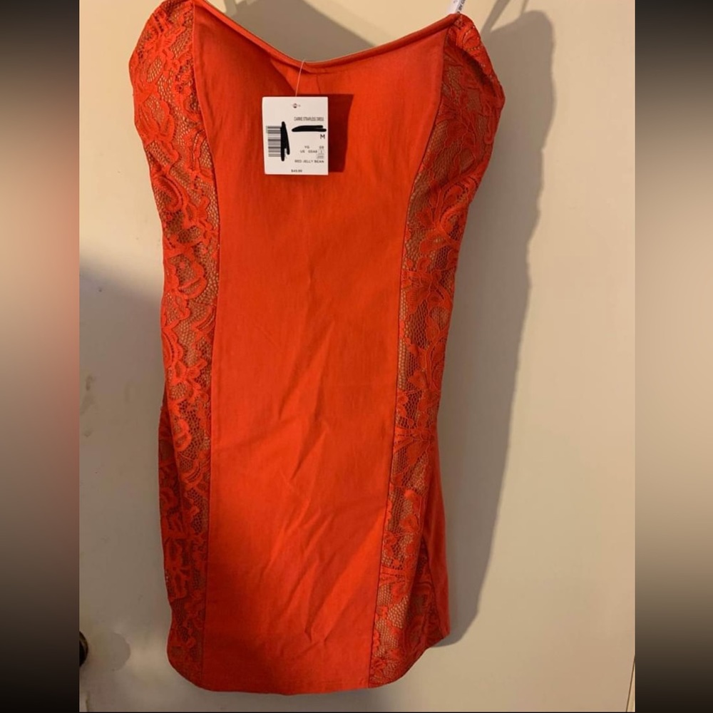 Red zip up dress. G by Guess. Never worn. Tags still attached